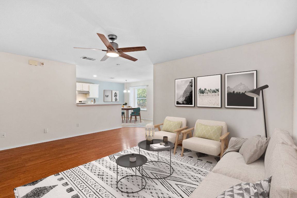 1700 Canon Yeomans Trail Austin, TX 78748 - Photo 1 of 32 a living room with furniture and wooden floor