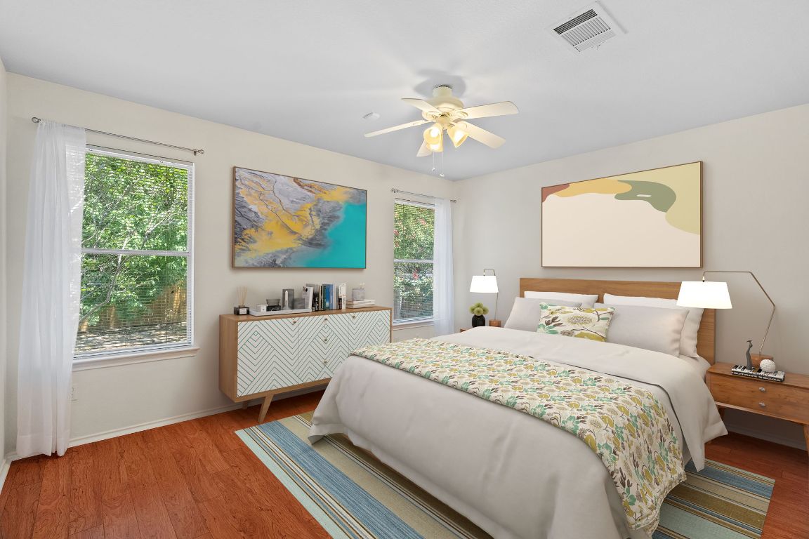 1700 Canon Yeomans Trail Austin, TX 78748 - Photo 19 of 32 a bedroom with a bed and a window