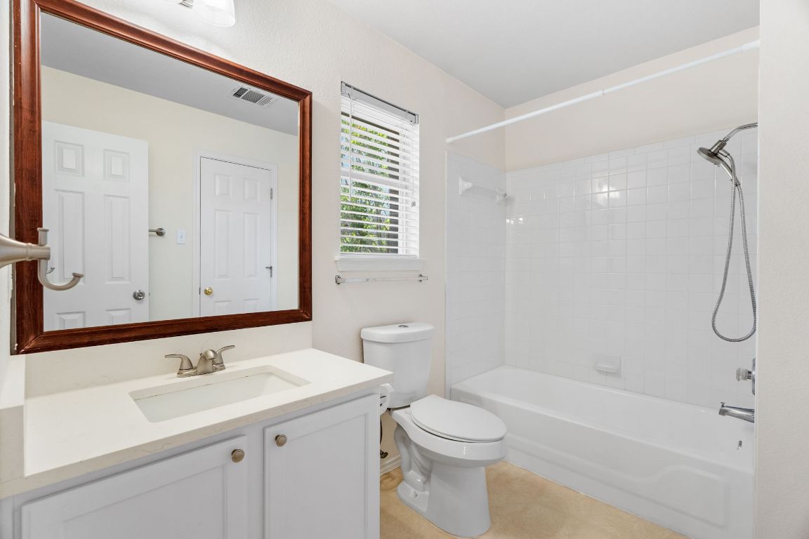 1700 Canon Yeomans Trail Austin, TX 78748 - Photo 22 of 32 a bathroom with a sink a toilet and shower