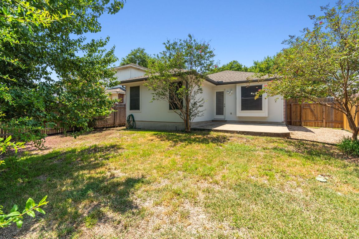 1700 Canon Yeomans Trail Austin, TX 78748 - Photo 27 of 32 a view of a house with a yard