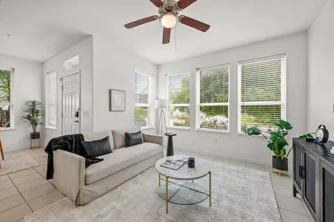 a living room with furniture and a large window