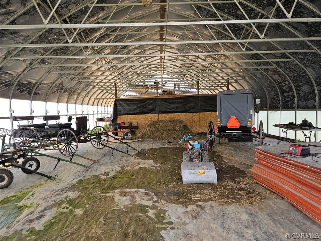 175 Raines Tavern Road Farmville, VA 23901 - Photo 11 of 46 a view of a patio with table and chairs potted plants