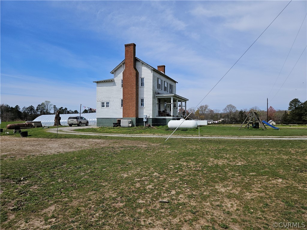175 Raines Tavern Road Farmville, VA 23901 - Photo 21 of 46 a front view of a house with garden