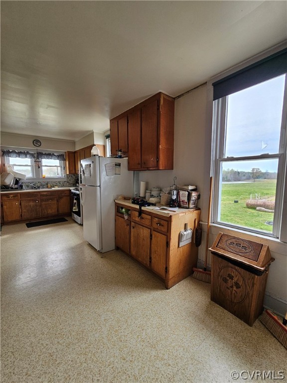 175 Raines Tavern Road Farmville, VA 23901 - Photo 41 of 46 a kitchen with stainless steel appliances kitchen island granite countertop a stove a sink and a refrigerator