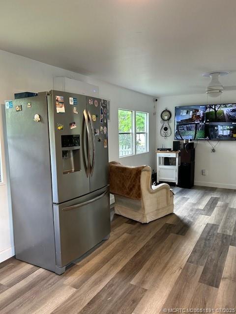 1944 Southwest College Street Stuart, FL 34997 - Photo 12 of 50 a living room with furniture and a refrigerator