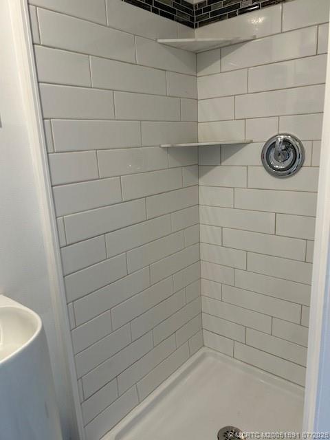 1944 Southwest College Street Stuart, FL 34997 - Photo 25 of 50 a bathroom with a shower