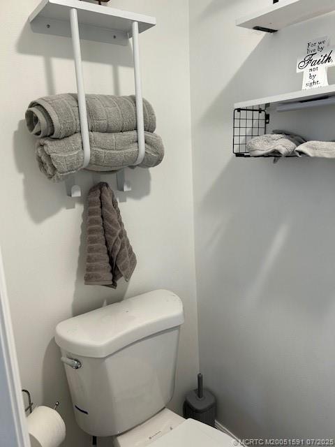 1944 Southwest College Street Stuart, FL 34997 - Photo 26 of 50 a bathroom with a toilet and a sink