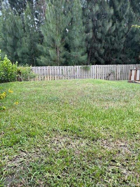 1944 Southwest College Street Stuart, FL 34997 - Photo 33 of 50 a view of a backyard with wooden fence