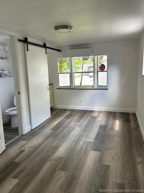 1944 Southwest College Street Stuart, FL 34997 - Photo 38 of 50 an empty room with wooden floor and windows