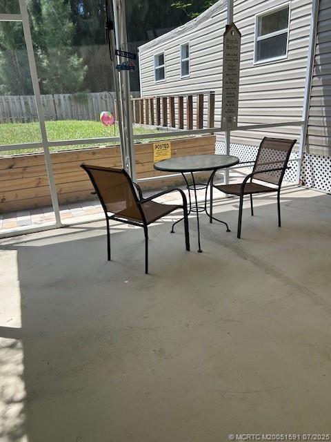 1944 Southwest College Street Stuart, FL 34997 - Photo 48 of 50 a view of a patio with a table and chairs