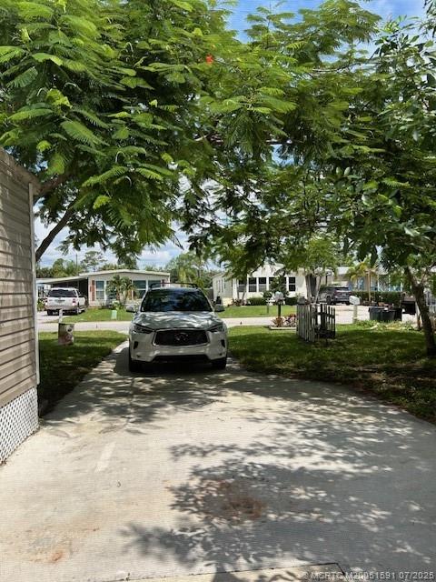 1944 Southwest College Street Stuart, FL 34997 - Photo 49 of 50 a view of a park with large trees
