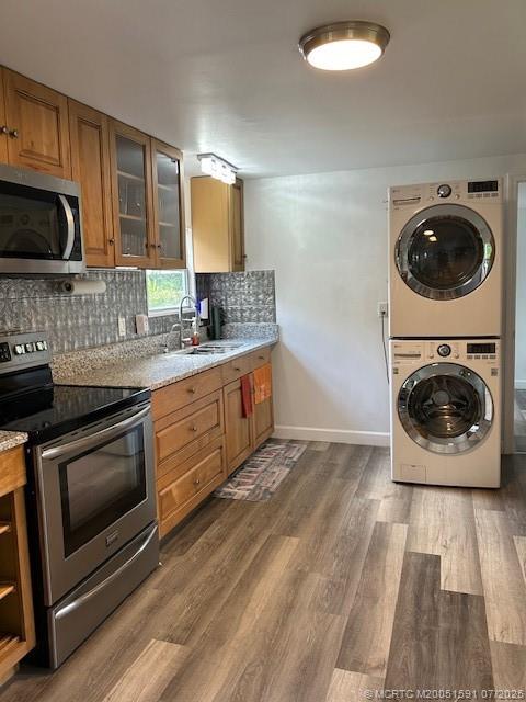 1944 Southwest College Street Stuart, FL 34997 - Photo 6 of 50 a kitchen with stainless steel appliances a stove a sink and a microwave