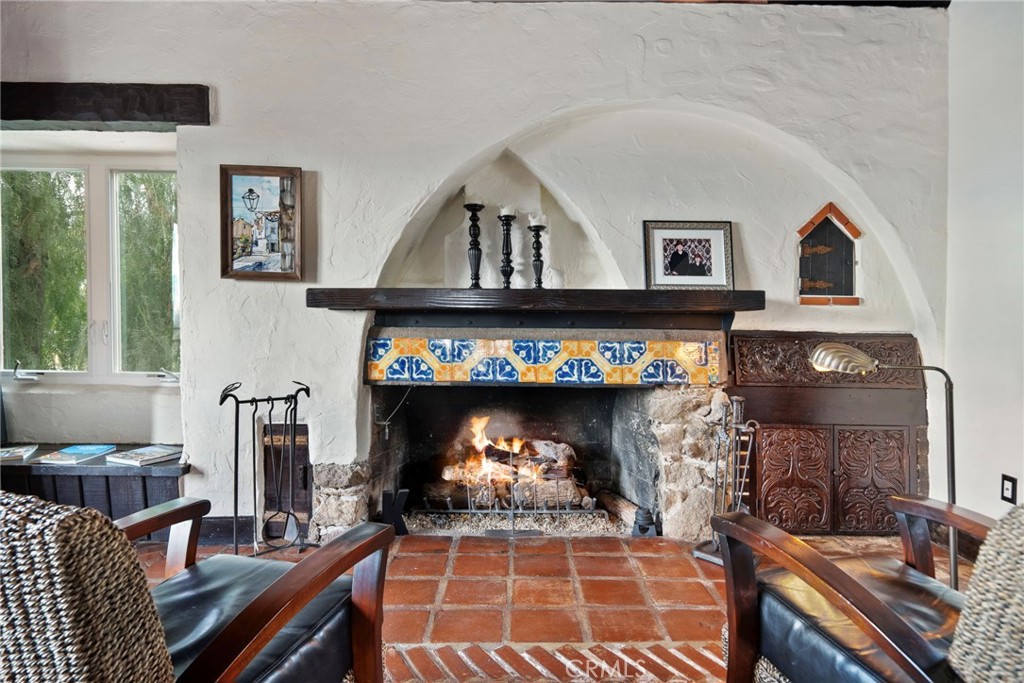 3240 Pachappa Hill Riverside, CA 92506 - Photo 25 of 75 a living room with furniture a fireplace and a large window