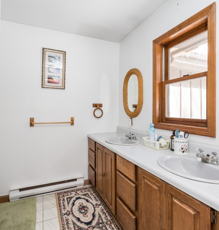 125 Bennett Road Hampden, MA 01036 - Photo 19 of 23 a bathroom with a granite countertop sink and a mirror