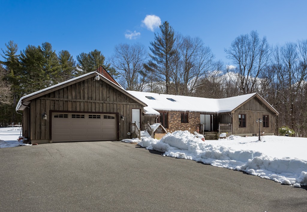 125 Bennett Road Hampden, MA 01036 - Photo 2 of 23 a house with trees in the background