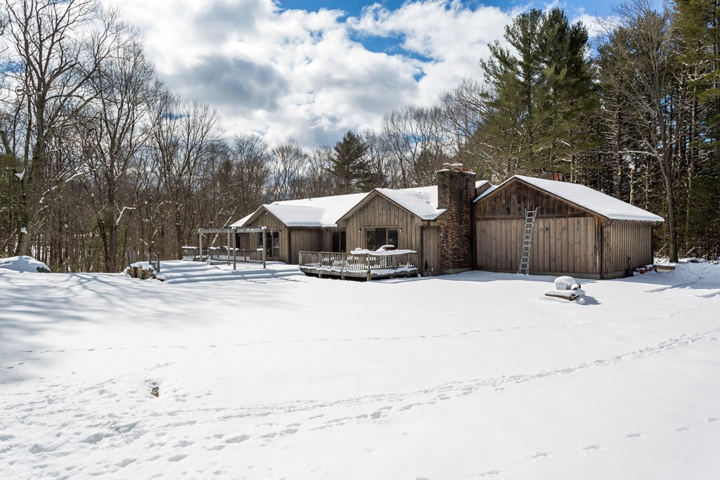 125 Bennett Road Hampden, MA 01036 - Photo 5 of 23 a house with trees in the background