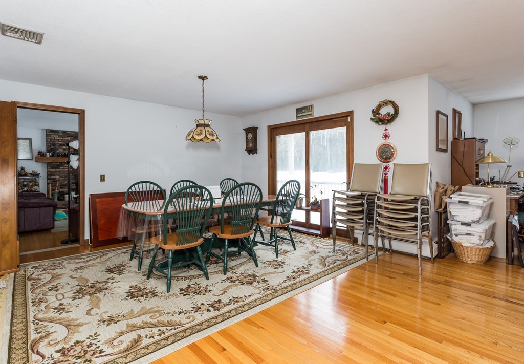 125 Bennett Road Hampden, MA 01036 - Photo 8 of 23 a view of a dining room with furniture window and wooden floor