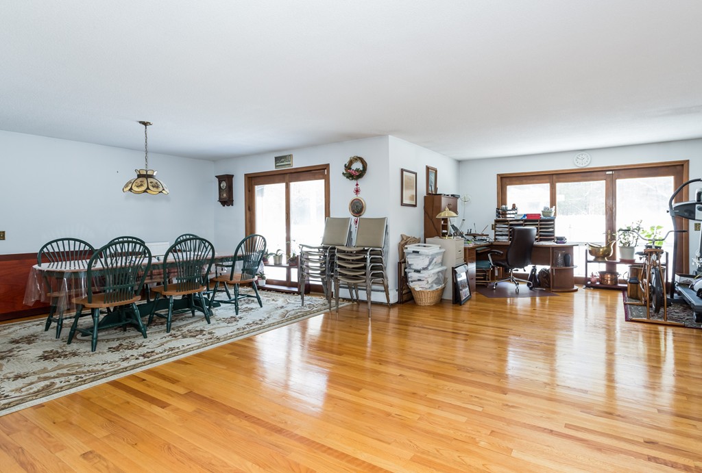 125 Bennett Road Hampden, MA 01036 - Photo 9 of 23 a living room with fireplace furniture and a large window