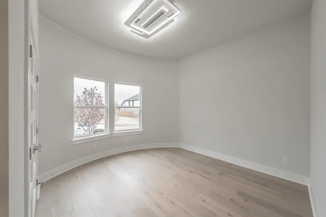 a bathroom with a sink double vanity granite tub shower and a mirror