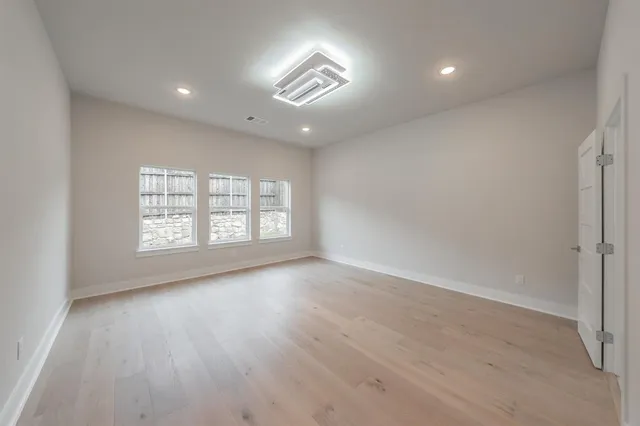 a bathroom with a double vanity sink and mirror