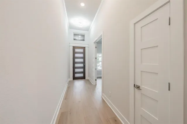 a view of kitchen with kitchen island and stainless steel appliances