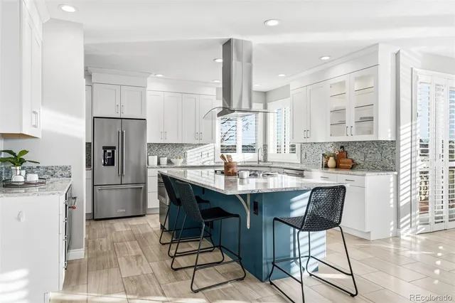 a kitchen with stainless steel appliances granite countertop a stove and a sink