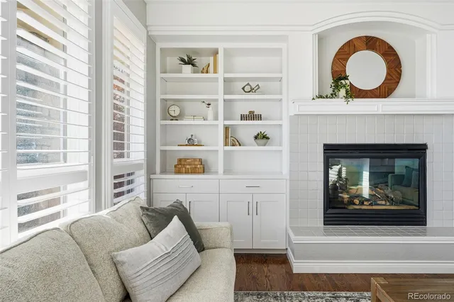 a living room with furniture and potted plant