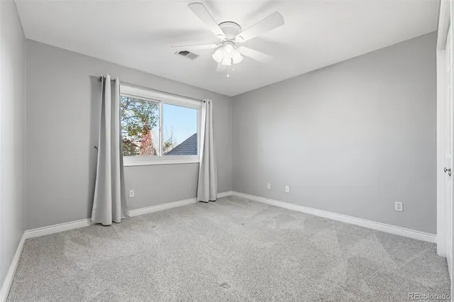 a bathroom with a sink toilet vanity and shower