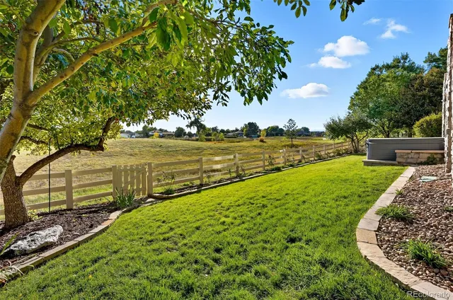 a view of a backyard with sitting area