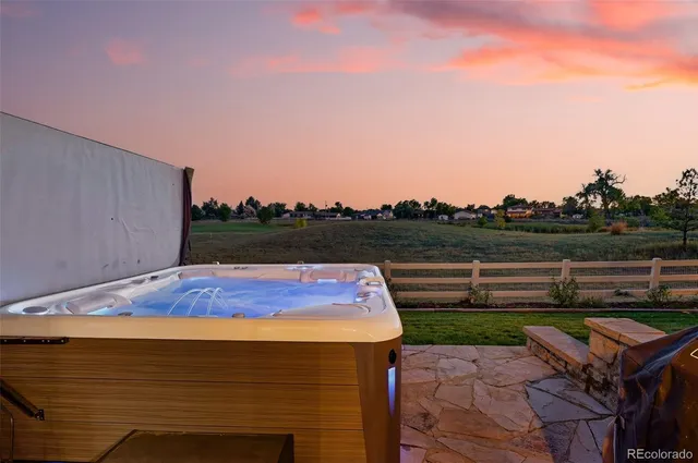 a view of a patio with a table chairs and a slide