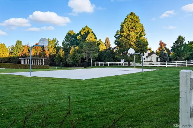 a view of a house with backyard and a sitting area