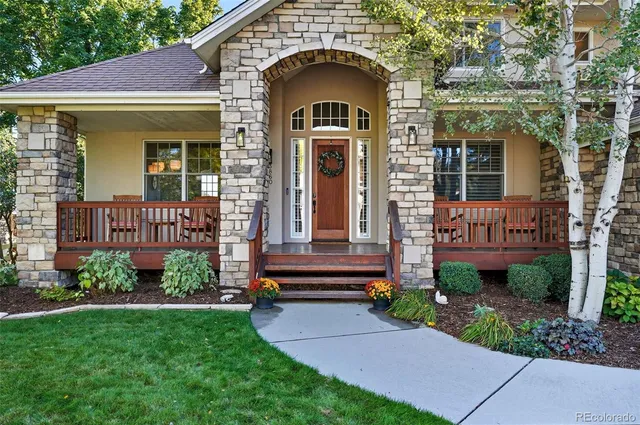 a view of a hallway with furniture and front door