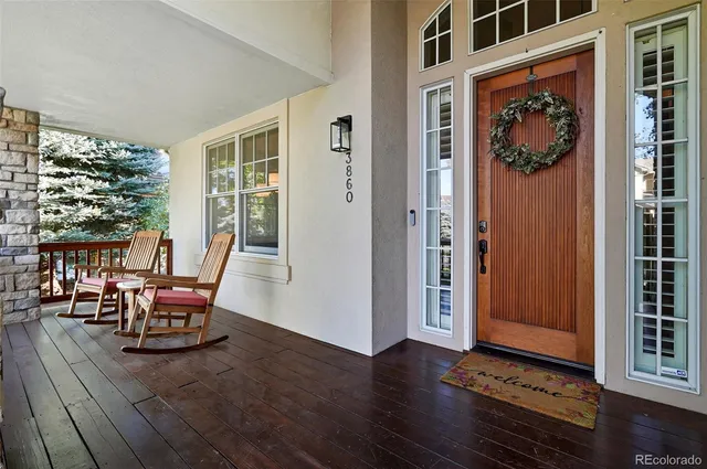 a view of a livingroom with furniture and hardwood floor