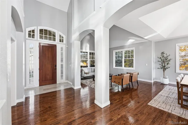 a view of a livingroom with furniture and hardwood floor