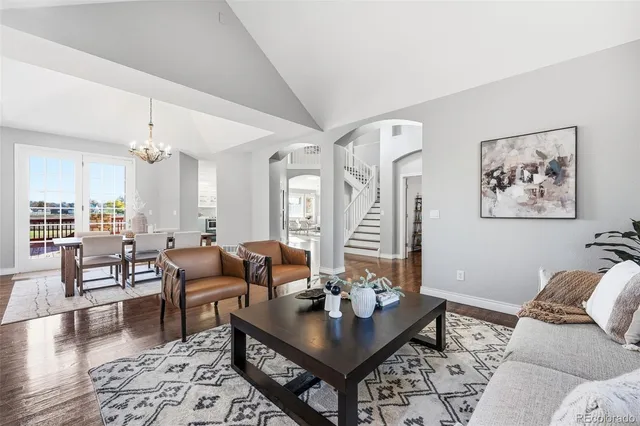 a dining room with wooden floor and a window