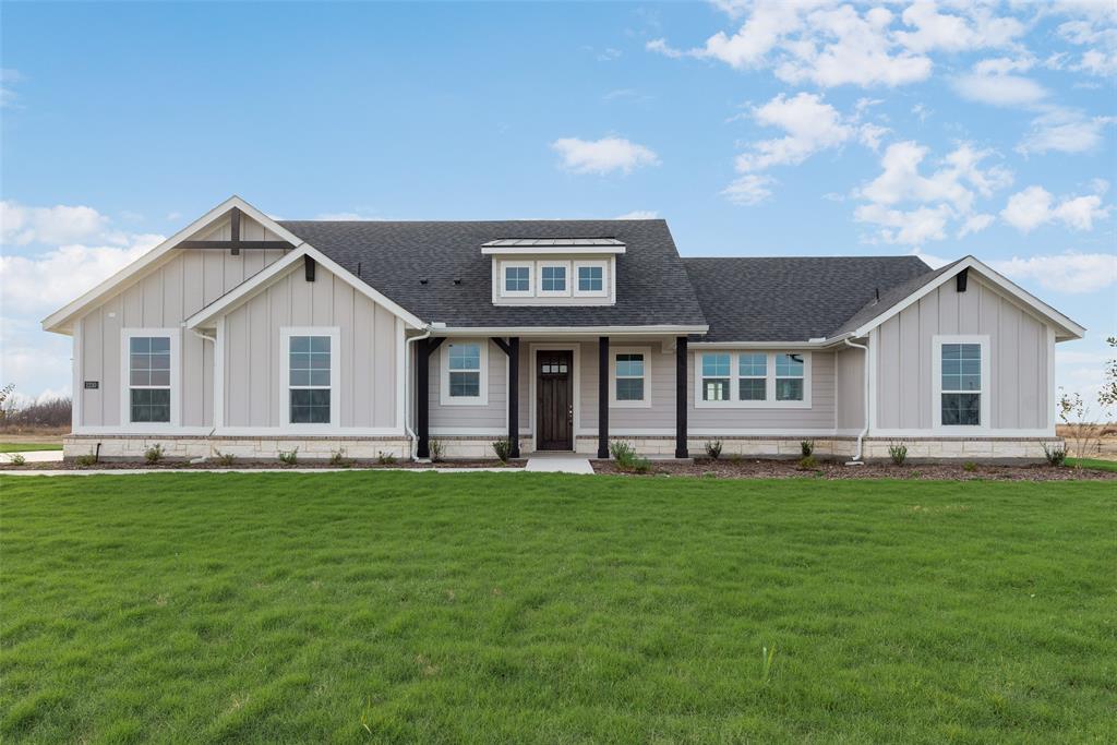 1230 County Road 200 Valley View, TX 76272 - Photo 2 of 26 View of front of house with roof with shingles, a porch, board and batten siding, and a front yard
