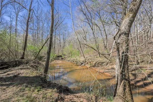 a view of mountain view with trees in the background