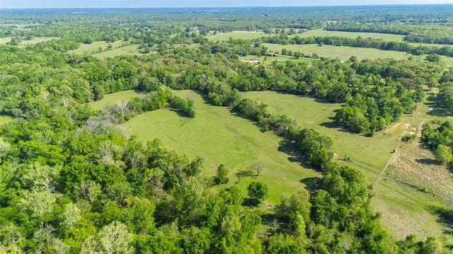 an aerial view of a yard with green space