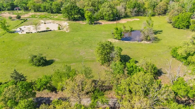 a view of a road with trees in the background