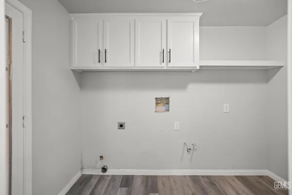 a view of cabinets and wooden floor