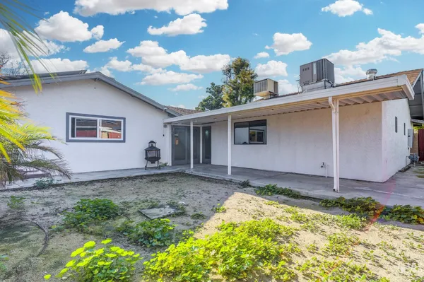 a backyard of a house with lots of green space