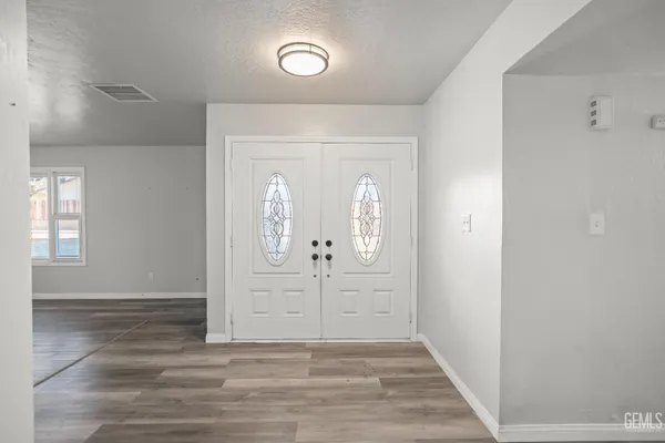 hallway view with wooden floor