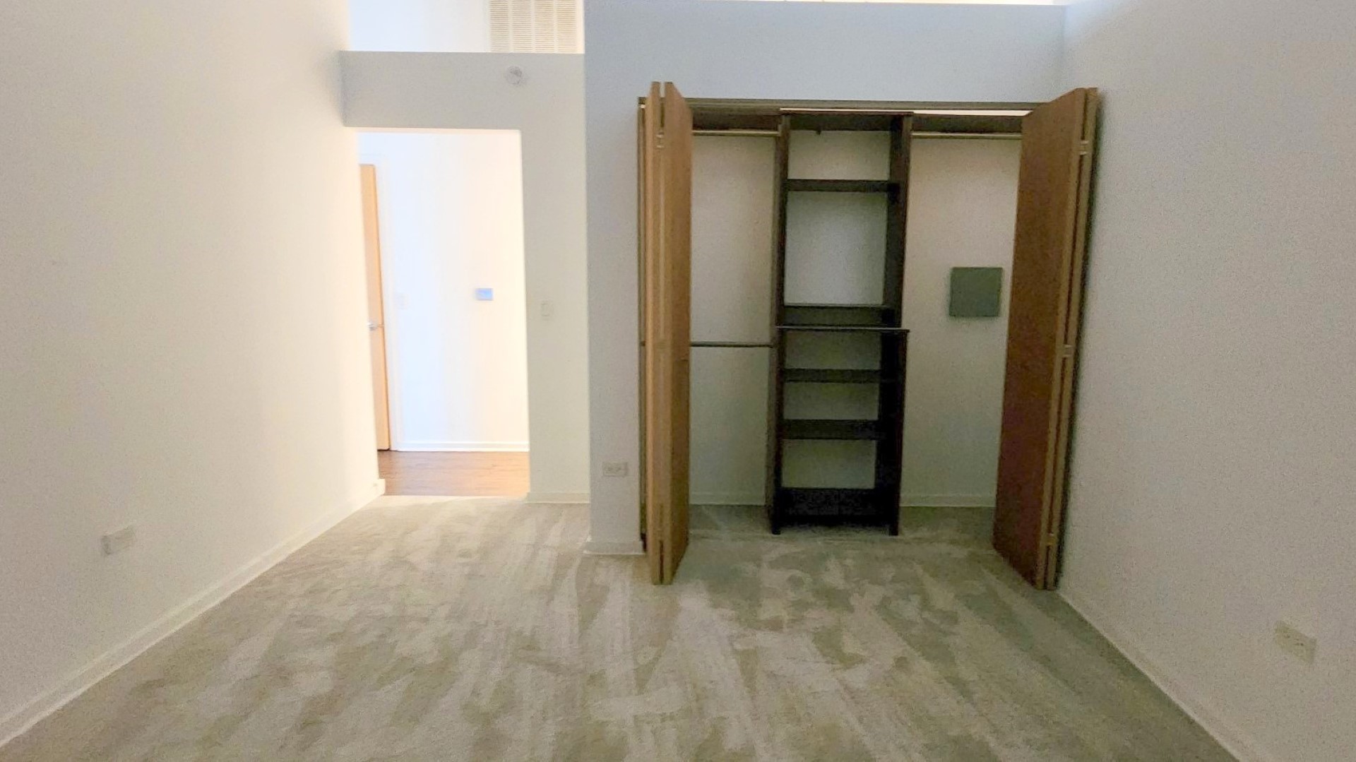 1645 West Ogden Avenue, Unit 417 Chicago, IL 60612 - Photo 11 of 19 an empty room with closet and a bathroom