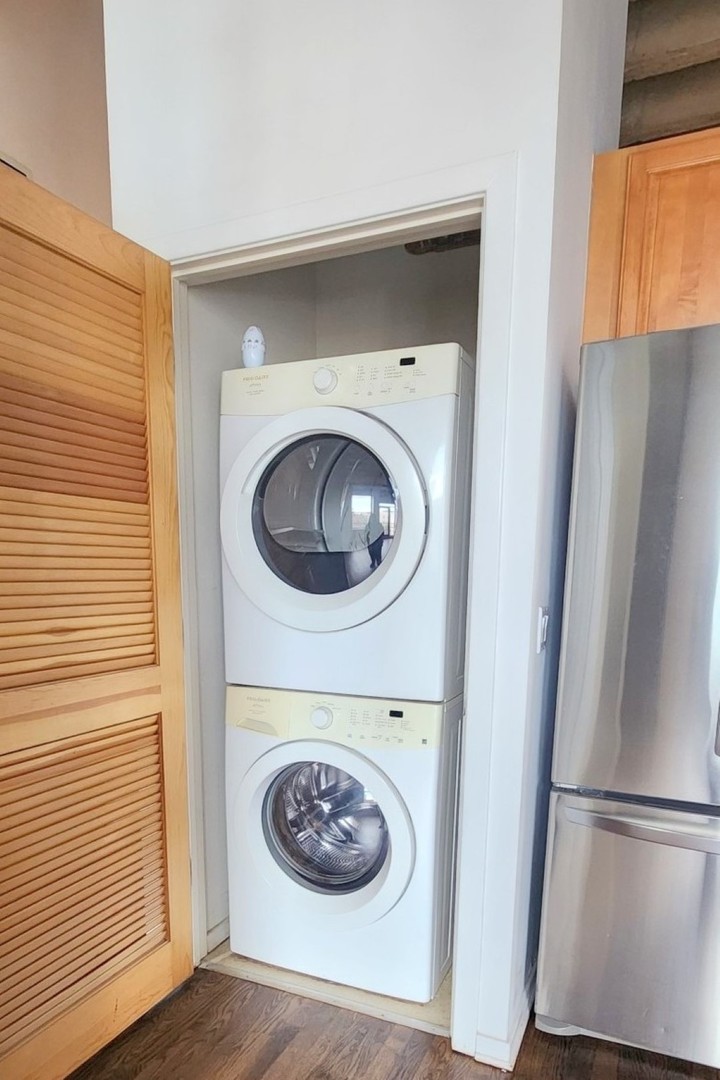 1645 West Ogden Avenue, Unit 417 Chicago, IL 60612 - Photo 13 of 19 a close view of a utility room with washer and dryer