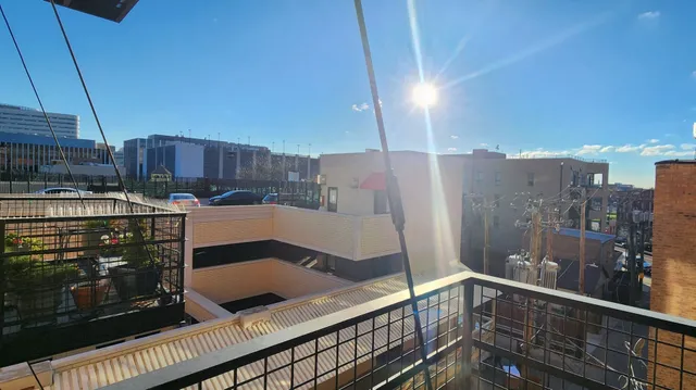 a view of a kitchen with a sink and cabinets