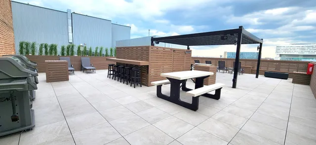 a swimming pool with outdoor seating