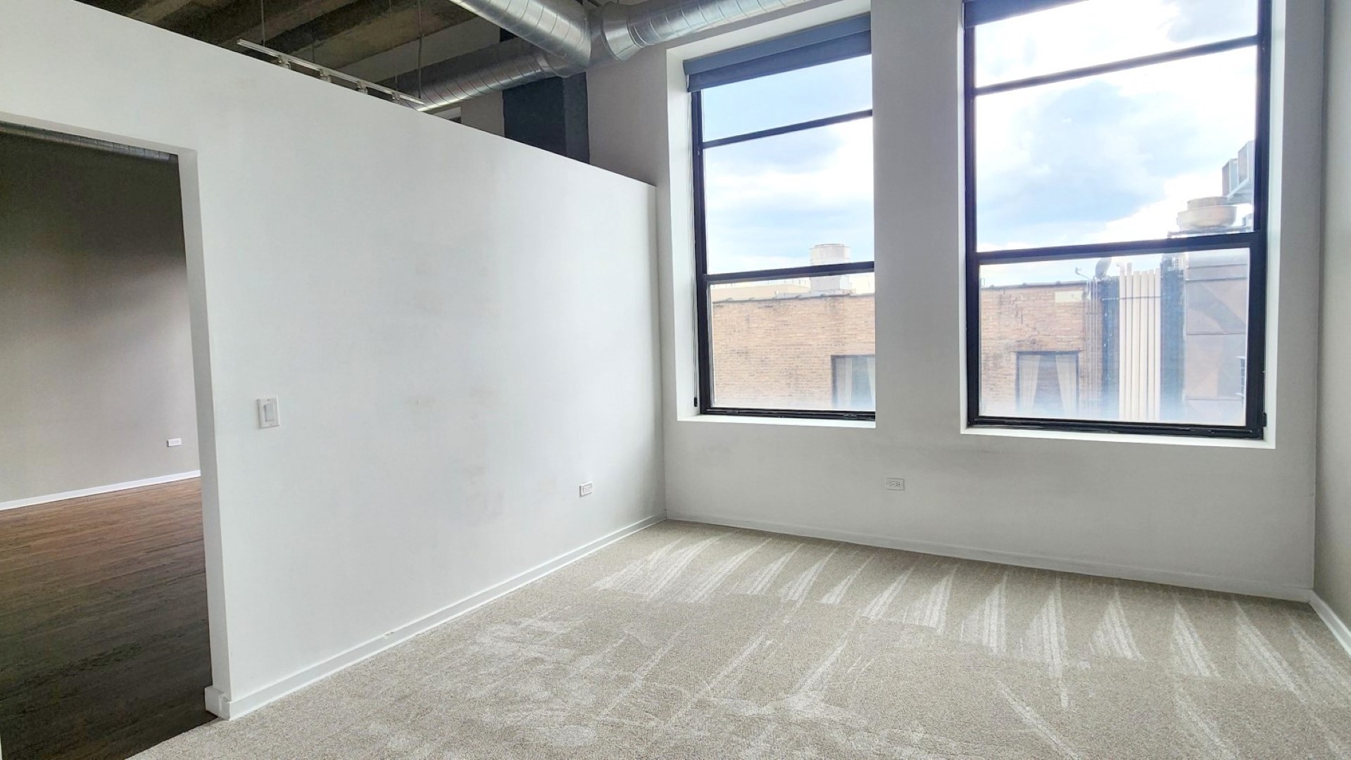 1645 West Ogden Avenue, Unit 417 Chicago, IL 60612 - Photo 5 of 19 a view of an empty room with a window