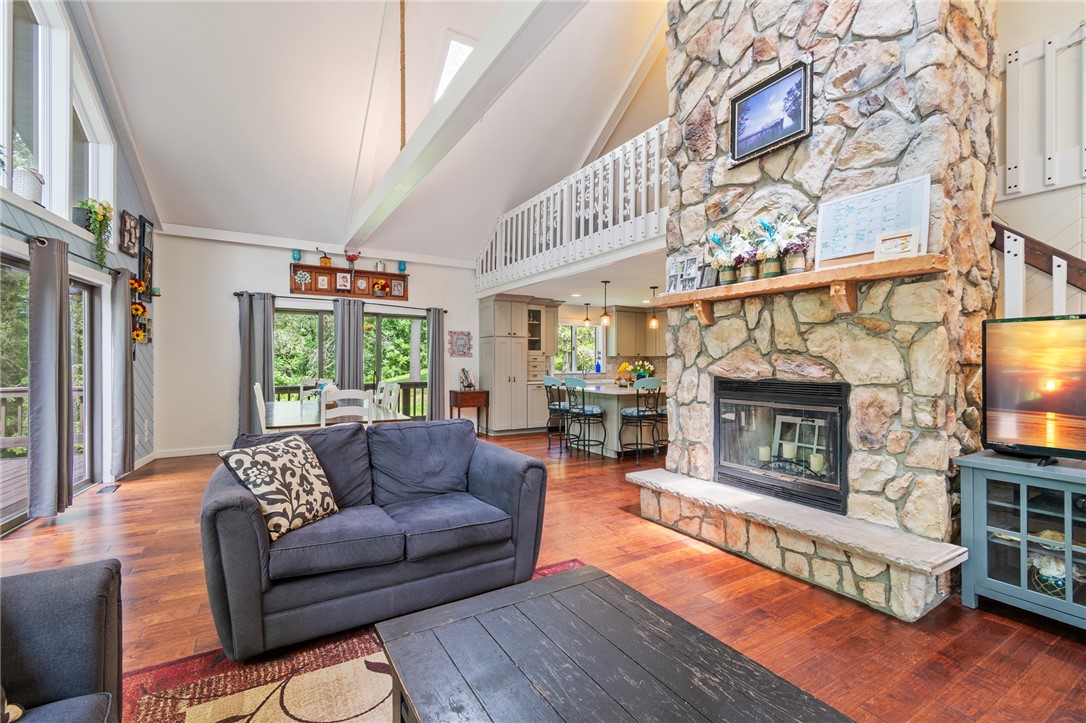 7733 East Port Bay Road Wolcott, NY 14590 - Photo 48 of 49 The OPEN FLOOR PLAN - easy care BIRCH hardwoods and a loft overlooking this space!