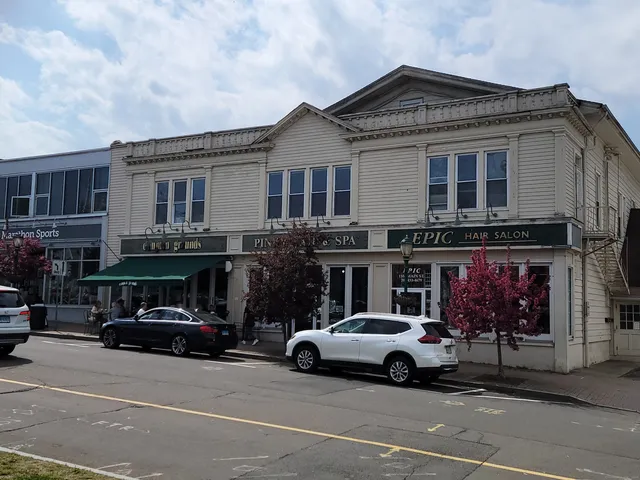 a view of a cars park in front of a building