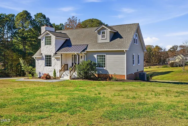 a view of a house with a big yard